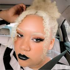 Is circus baby's hair red or orange? I always think it looks orange but I  see people doing cosplays of her with red hair. I wanted to dress as her  for Halloween