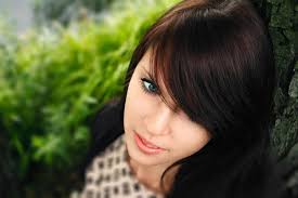 Beautiful woman enjoying daisy field, nice female lying down in meadow of  flowers