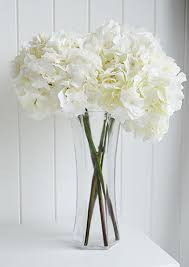 Fixed within a blue glass vase, place this stunning ornament on your bedroom's vanity next to your bottles. Artificial Silk White Hydrangea