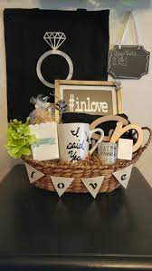 Last week, i stopped by hobby lobby and picked up a basket, paint and craft supplies to dress up the basket. Engagement Gift Basket Send A Basket To Congratulate The Bride Groom To Be The Baske Engagement Gift Baskets Wedding Engagement Gifts Unique Engagement Gifts
