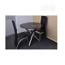 Round drop leaf kitchen table with two chairs tall backrest. Uni Round Dining Table 2 Chairs Black In Ojo Furniture Daniel Nnamani Jiji Ng