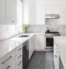 Inspiration for a timeless kitchen remodel in los angeles with a farmhouse sink, open cabinets, white cabinets, white backsplash, subway tile backsplash, black appliances and limestone countertops. 75 Beautiful White Kitchen Backsplash Pictures Ideas Houzz