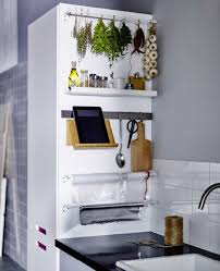 The Side Of A Tall Kitchen Cabinet With Baskets And Rails For A Laundry Station Koch Utensilien Ikea Ideen Und Kuchenschrank