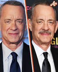 At 67, Tom Hanks has switched it up from rocking a clean shaven look to  sporting a mustache. What do you think of his new appearance? 🤔