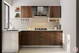 The stone tiled backsplash with the cherry wood makes for a creative cooking experience. 15 Modern Kitchens In Wood Finish