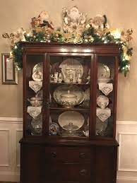 On Top Of The Cabinet China Cabinet Decor Christmas Dining Room Easy Christmas Decorations