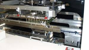 Bed-of-nails ICT fixture testing a PCB for quality assurance.