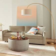 Many arc lamps rise up before curving over, resembling the branches of a tree. Overarching Linen Shade Floor Lamp