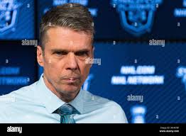 Ottawa Senators head coach Dave Cameron, left, leads a practice at the  Canadian Tire Centre in Ottawa with player David Legwand