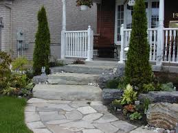 Rather than installing a wide front walkway which is dry laid or set in concrete, consider using separate stones set right into the grass. Stone Front Step Designs Birkslandscaping Dma Homes House Door Steps Design Ideas Home Elements An Landscape Design Entry Garden Ideas Small Entry Garden Ideas