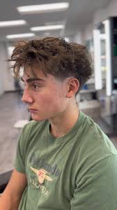 Low taper fade with fluffy fringe 💈 client wanted to keep the bulk