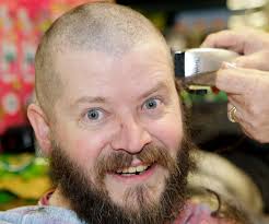 Charity head shave by Tesco workers