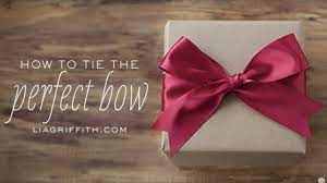 Fold the left loop over the right loop. How To Tie The Perfect Bow Youtube