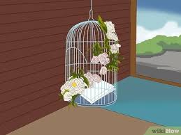 Decorative birdcages with floral or candle arrangements inside and ribbon or tulle embellishments outside could be the elegant touch you're looking for. 3 Simple Ways To Decorate A Bird Cage Wikihow