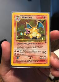 This card has the circle holo affect. Base Set 2 Charizard In Great Condition Some White On The Back Not That Bad Tho It S Really Old Vintage Card Wi All Pokemon Cards Cool Pokemon Cards Pokemon