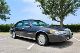 Image result for Medium Gold 1998 Town Car