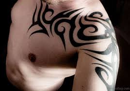 This striking design looks amazing as a shoulder and back tattoo. 40 Likable Tribal Shoulder Tattoo Designs
