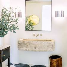 To make up for lost storage, install a shelf and a recessed medicine cabinet above the sink. 8 Beautifully Chic Bathroom Vanities