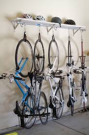 You'd like to up your organization, but this isn't just a matter of adding a couple of shelves here. Diy Shelf Bike Rack Diy Bike Rack Garage Storage Organization Garage Organization Tips