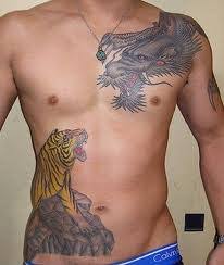 Rib cage area is a perfect canvas for tattoo artist to work on. Men Rib Cage Tattoo Designs