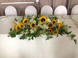 Wedding linens, plates, cups & wedding table settings. Top Table Sunflowers And Dahlias Sunflower Centerpieces Bridal Table Decorations Sunflower Table Centerpieces