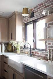Upgrade to one of these for free: Cc And Mike Kane Project Remodel Reveal Brick Kitchen Bacskplash With A White Farmhouse Sink And Black Faucet Rift Sawn White Oak Cabinets With Black Hardware 7 Cc Mike