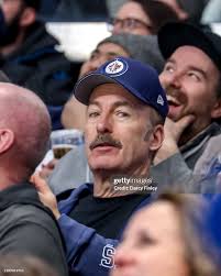 Bob Odenkirk takes in second period action between the Winnipeg Jets and  the Columbus Blue Jackets at the Canada Life Centre
