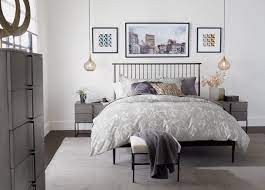 I love the contrast of the all white bedding against the moody blue walls and the mirrored accents. Urban Meets Mid Century Modern Bedroom Ethan Allen Design Ideas Ethan Allen
