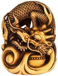 It was originally a carved toggle part of a box that helped a person wearing a kimono carry personal effects. International Netsuke Society Faq