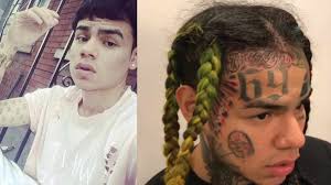 He has a knife tattoo on his forehead. 10 Musicians Before And After Their Iconic Face Tattoos Tattoo Ideas Artists And Models