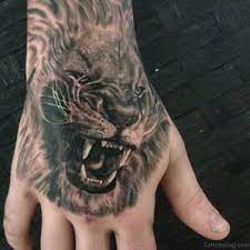 41 Best Lion Tattoos On Hand Lion Tattoo Mens Lion Tattoo Hand Tattoos