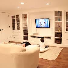 Ikea large wall shelf, ikea wall shelves, ikea white shelves, ikea large wall shelves, living room shelf units, living room wall units. Wall Of Built Ins Out Of Ikea Hemnes Cabinets Ikea Built In Ikea Hemnes Cabinet Basement Decor
