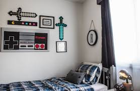 Designing a video game room in your house dedicated solely to the love of playing games can offer some unique and fresh decorating ideas. An Industrial Shared Boy S Room With A Hint Of Minecraft Alphadorable Custom Nursery Art And Decor Shared Boys Rooms Boy Bedroom Design Boys Bedrooms