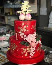 Asian chinese man on birthday celebration wearing funny hat over isolated red background with happy face smiling doing ok sign. Chinese Birthdays Has A Tradition Where The Celebrants Family Wear Red The Color Of Luck Happiness And Prosperity You Wear Red And A Chinese Birthday Party A