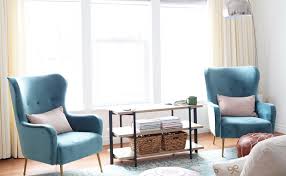 Instead Of A Small Side Table Between Her Accent Chairs Aileen Picked A Low Profile Three Shelf Storage Organized Living Small Side Table Living Room Storage