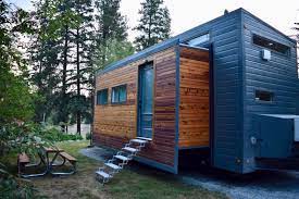 Couple S Expanding Tiny House On Wheels Almost Doubles In Space With Slide Outs Off Grid Tiny House Best Tiny House Building A Tiny House