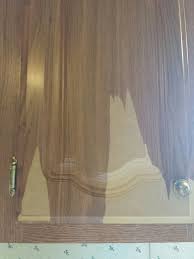 Vacuum any sanding dust, and then wipe the cabinet down with a damp cloth. How To Paint Peeling Paper Covered Cabinets Hometalk