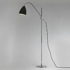 Floor lamps table are ideal for home design projects and give space a confident look with desirable lighting. Black And Chrome Floor Reading Lamp With Angled Arm And Shade