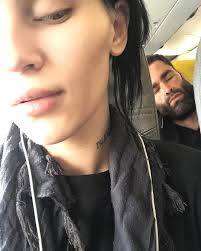 The man rubbing his hand behind a tree" Anthony Adams Rubbing Hands refers  to a photograph of former professional football player Anthony "Spice"  Adams dressed in a yellow jacket, peeking from behind