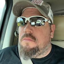 What is the white cotton-like substance stuck to spider webs and blowing  around?