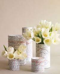 Crafting With Souvenirs 9 Diy Projects Using Maps Travel Bridal Showers Travel Theme Bridal Shower Wedding Centerpieces Diy