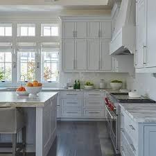 Light Gray Stacked Kitchen Cabinets With Rustic Wood Floors Kitchen Design Beach House Kitchens Florida Beach House