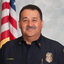 Sinbad of the Maniac Latin Disciples and Lil Casper of the Simon City  Royals posing by the new Folks Unity mural done at Horner Park in 1984.