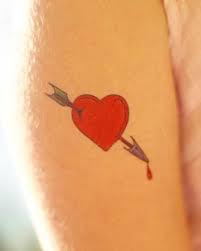 Shattered heart stitched heart tattoo. Broken Heart Tattoo Designs Lovetoknow