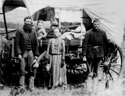Oregon Trail pioneers. These people weren't looking to make a fashion  statement; they were looking for a better life and a way West against  incredible odds. They wore what worked...oregon trail -