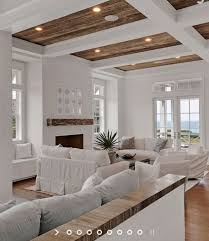 White Beams With Wood Ceiling Opposite From What You Usually See Love It High Ceiling Living Room Home Living Room Coastal Living Rooms