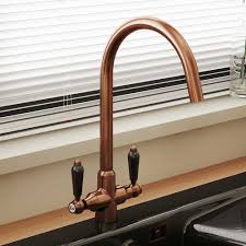 Stainless steel, chrome or black brass would fit right in in a practical and modern kitchen. Astini Colonial Antique Copper Black Ceramic Handle Kitchen Sink Mixer Tap Kitchen From Taps Uk