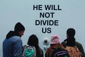 Participants were invited to chant the mantra he will not divide us into the camera but the project soon went off the rails when trump detractors, trump supporters, and internet trolls all converged at the site to say their pieces and inevitably clashed with each other. He Will Not Divide Us Exhibit The Torch