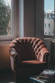 You need to relax after a hard day at work. Tufted Brown Suede Sofa Chair Near Windows Photo Free Berlin Image On Unsplash