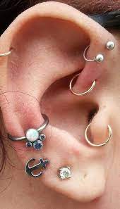Conch Piercing What Is This Piercing All About Tats N Rings Piercings Silver Ear Cuff Piercings Ear Conch